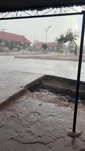Heavy rain falls on roundabout in Rafin Par, Nigeria