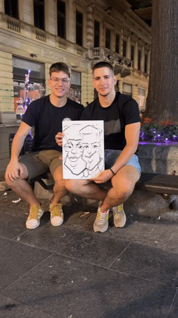 Street artist draws caricatures for customers in Belgrade evening