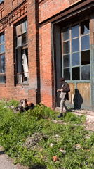 Person in vintage attire spotted near damaged Sestroretsk building