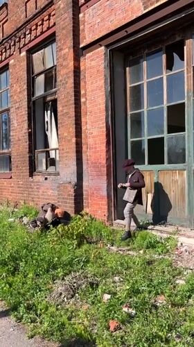 Person in vintage attire spotted near damaged Sestroretsk building