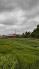 Krasnodar residents document trains, traffic, cityscape on cloudy day