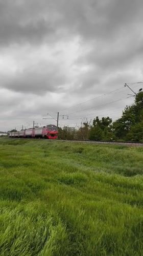 Krasnodar residents document trains, traffic, cityscape on cloudy day