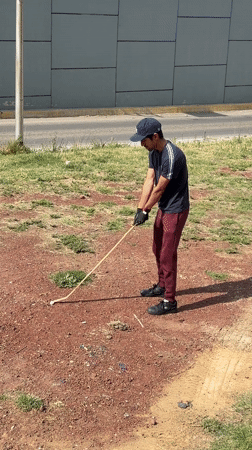 Man with wooden stick observed roadside in Cholula