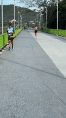 Early morning runners cross bridge in Ban Bang Rak