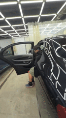 Car detailing session documented at Krasnoyarsk garage facility