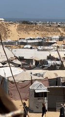 Khan Yunis scenes show damaged buildings, displacement camp, daily life