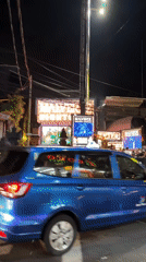 Night traffic bustles around Kuta nightclub district