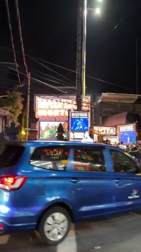 Night traffic bustles around Kuta nightclub district