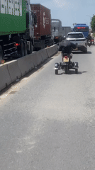 Custom three-wheeled vehicle spotted on busy Vietnam road