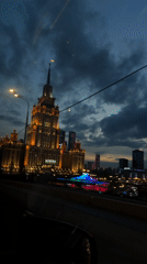 Evening view of illuminated Hotel Radisson Collection in Moscow