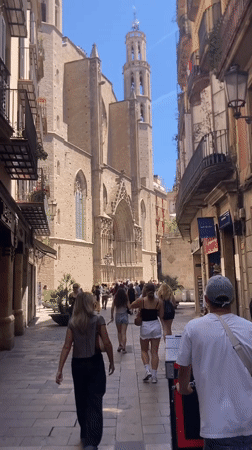 Tourist documents afternoon walking tour through central Barcelona districts