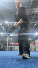 Man practices padel on indoor court in Moscow