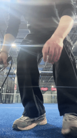 Man practices padel on indoor court in Moscow
