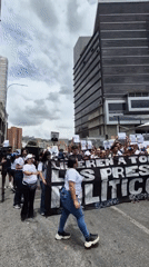 Protesters march in Caracas demanding release of political prisoners