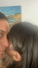 Mother and child share quiet moment in Cabo Frio home