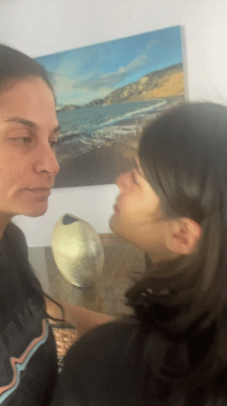 Mother and child share quiet moment in Cabo Frio home