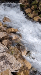 Clear water foaming over rocks in a shallow Kazan stream
