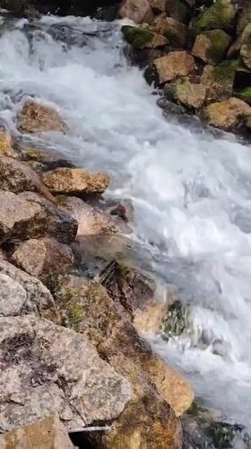 Clear water foaming over rocks in a shallow Kazan stream