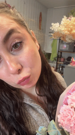 Woman with carnation bouquet spotted at Liepāja flower shop