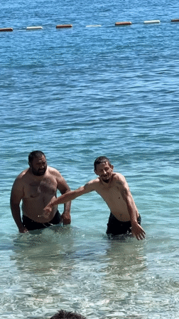 Summer afternoon beach activities unfold at Budva Montenegro waterfront