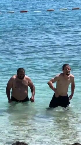 Summer afternoon beach activities unfold at Budva Montenegro waterfront