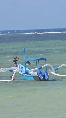 Kitesurfing action at Sanur beach, Bali