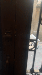Person resting on cardboard observed on Barcelona sidewalk
