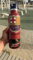 Man displays customized Barcelona FC water bottle with skateboard stickers