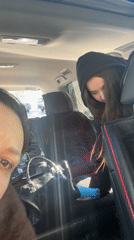 Two women in car back seat, Nizhnevartovsk morning