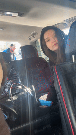 Two women in car back seat, Nizhnevartovsk morning