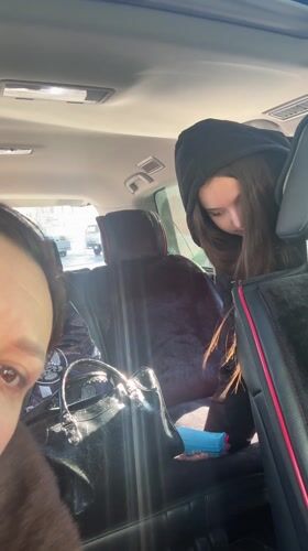 Two women in car back seat, Nizhnevartovsk morning