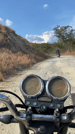 Motorcyclists ride rural dirt roads in Venezuela countryside