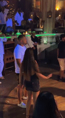 Dance floor moments in a dimly lit ornate club