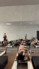Pilates class in session with dozen women in Mengwi studio