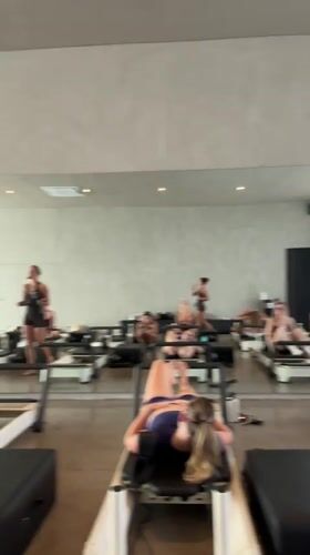 Pilates class in session with dozen women in Mengwi studio
