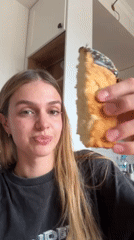 Woman displays decorated cake slice near documented elevator location