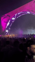 Nighttime music festival draws crowds to illuminated arch stage in Giza