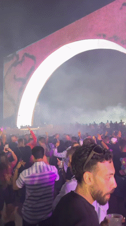 Nighttime music festival draws crowds to illuminated arch stage in Giza