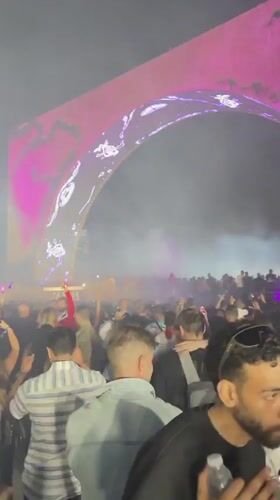 Nighttime music festival draws crowds to illuminated arch stage in Giza