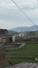 Light spring snowfall blankets rural Tyulyuk landscape