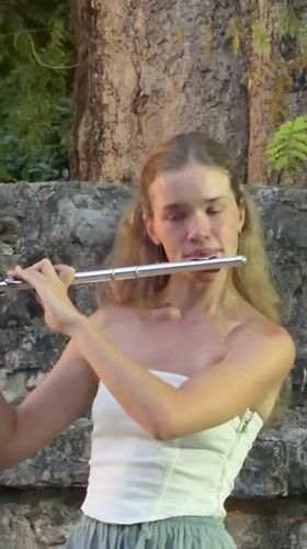Flute performance against Budva's old stone walls