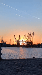 Sunset observed over Port of Varna harbor with cranes