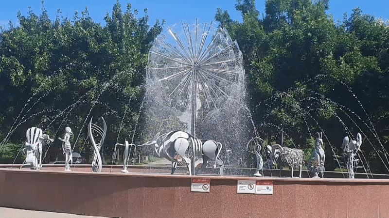 Morning at a Chișinău fountain, coffee in hand