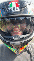 Motorcyclist records selfie video while riding in Mengwi, Indonesia