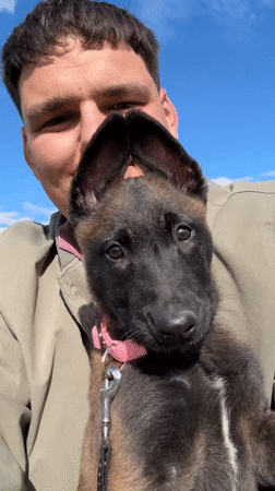 Young man with puppy spotted in Bulgarian village