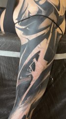 Tattoo session documented in Moscow parlor