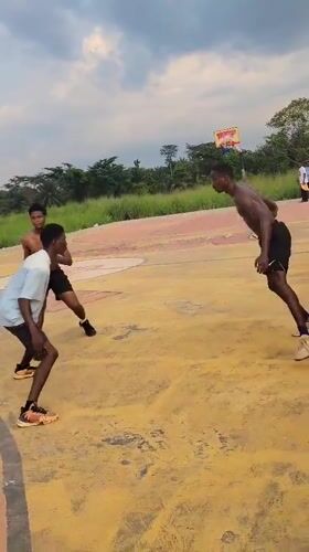 Pickup basketball on a weathered outdoor court in Egbagu, Nigeria