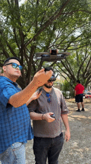 Two men operate DJI drone in Cuernavaca park