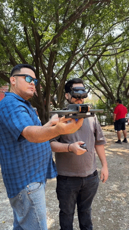 Two men operate DJI drone in Cuernavaca park
