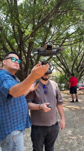 Two men operate DJI drone in Cuernavaca park